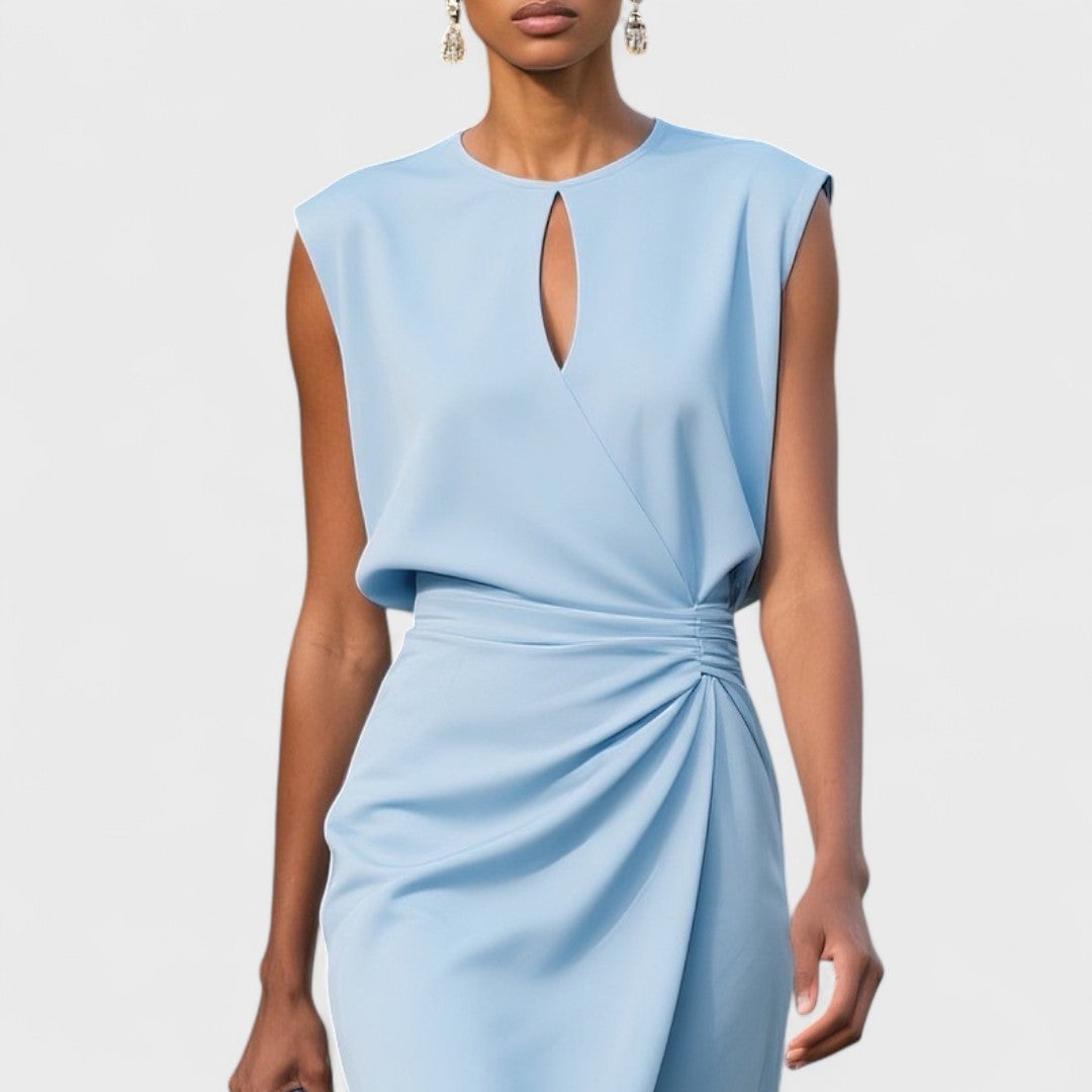 Model styling the Kathy elegant classy dress with heels for an elevated occasion look