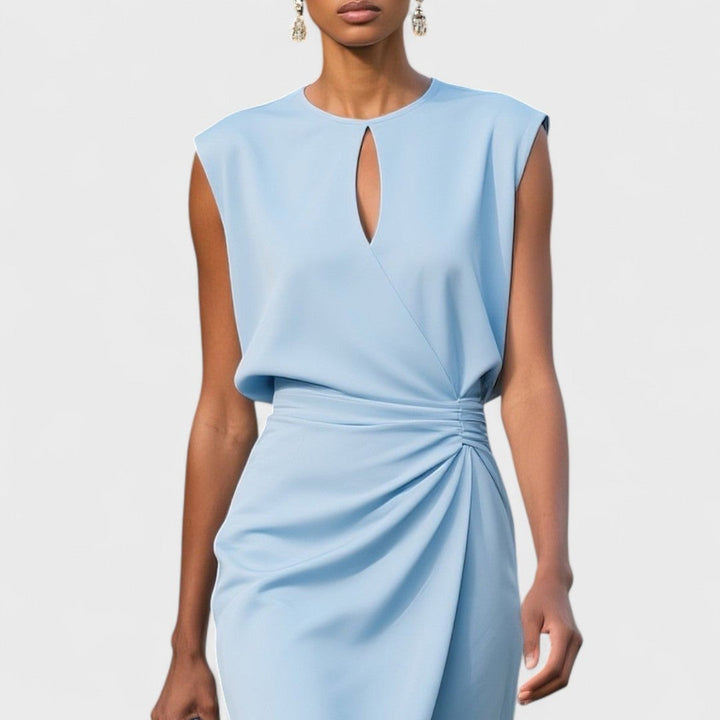 Model styling the Kathy elegant classy dress with heels for an elevated occasion look