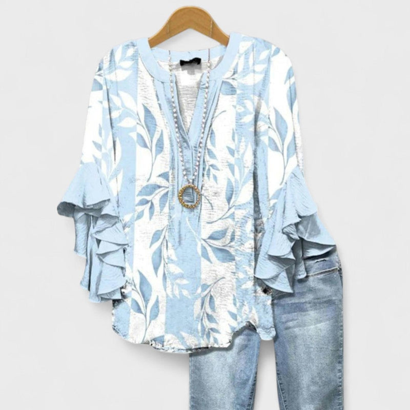 Front view of the Kay lightweight day blouse in light blue, styled with casual everyday wear
