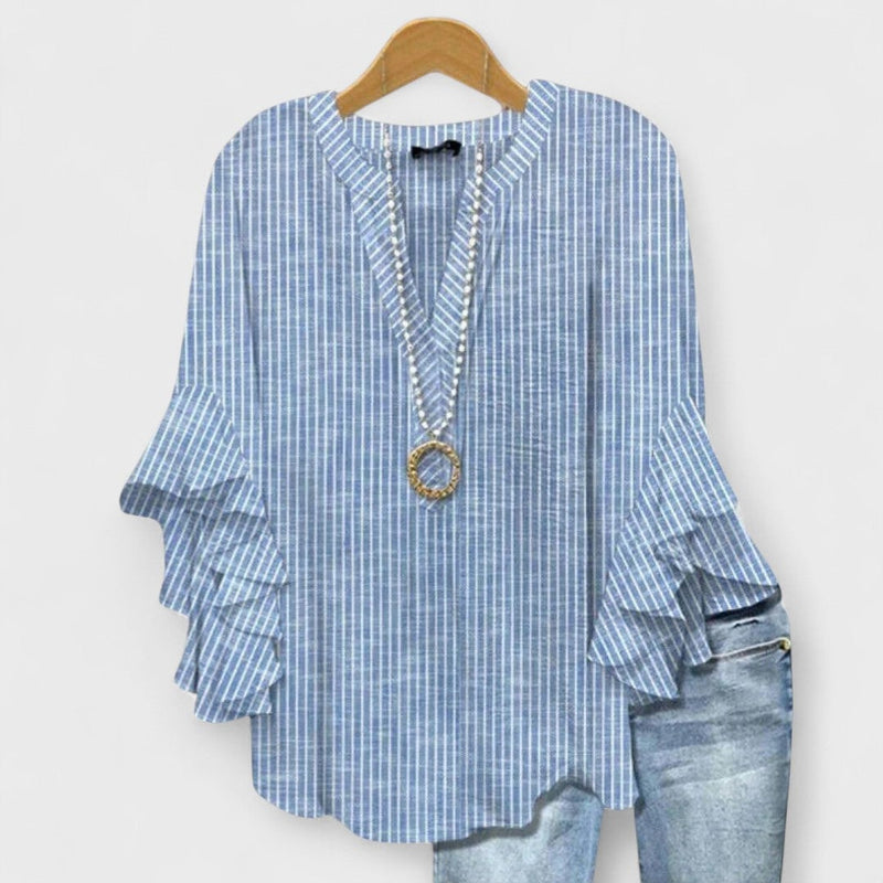 Kay lightweight day blouse in blue displayed on a model, showing the airy fabric and feminine fit