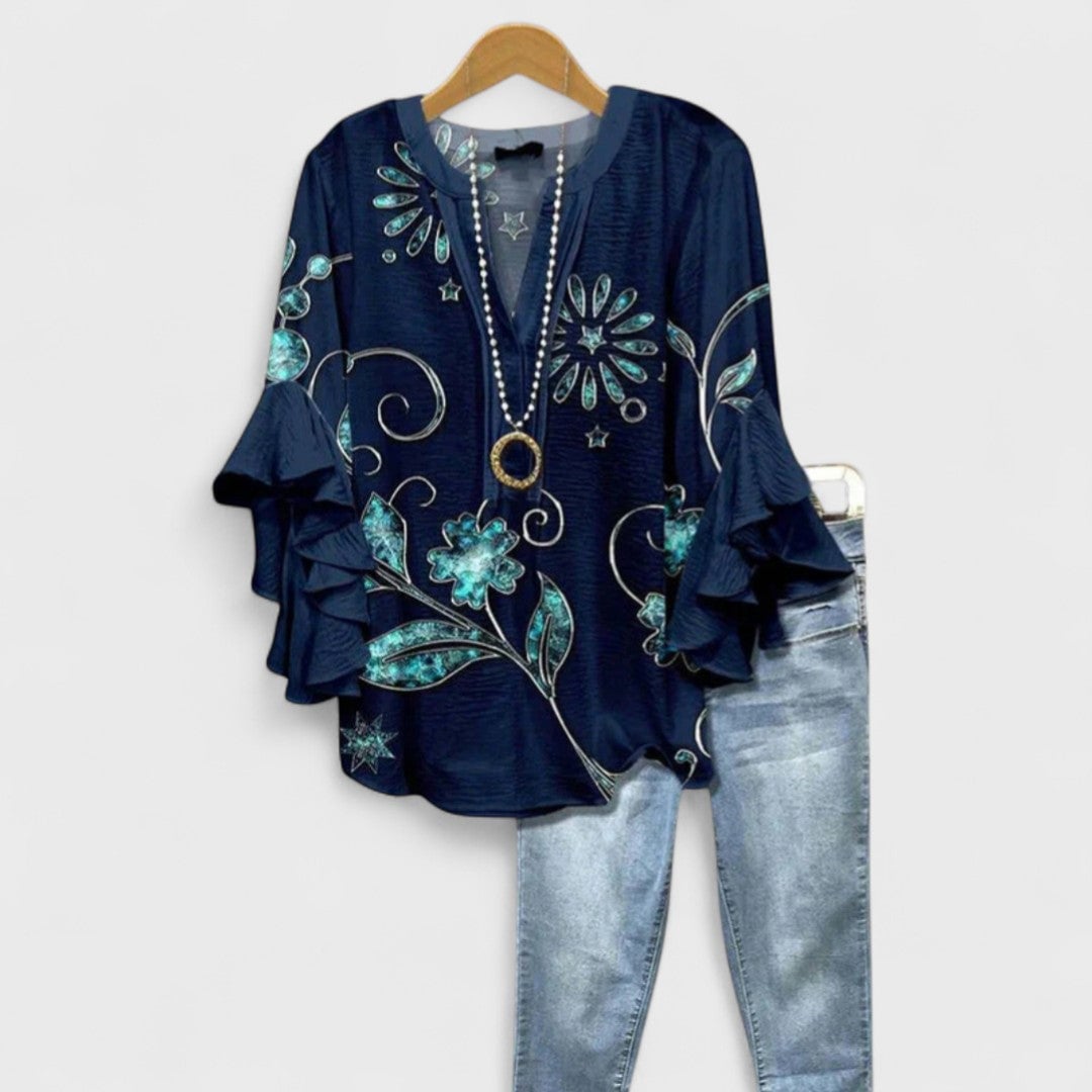 Flat lay of the Kay lightweight day blouse showing the full length and color options available