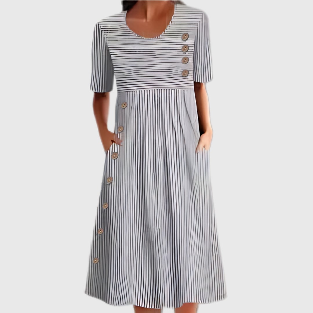 Close-up of the striped pattern and button detail on the midi dress in blue and gray