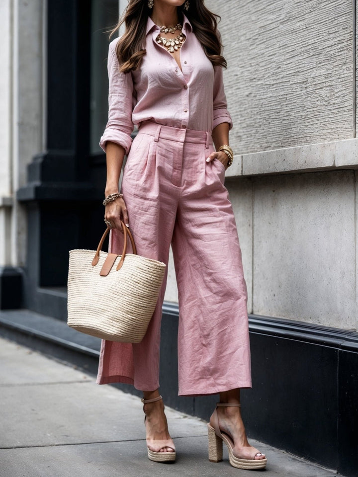 Woman wearing a coordinated loose shirt and capri pants set in a relaxed warm-weather style
