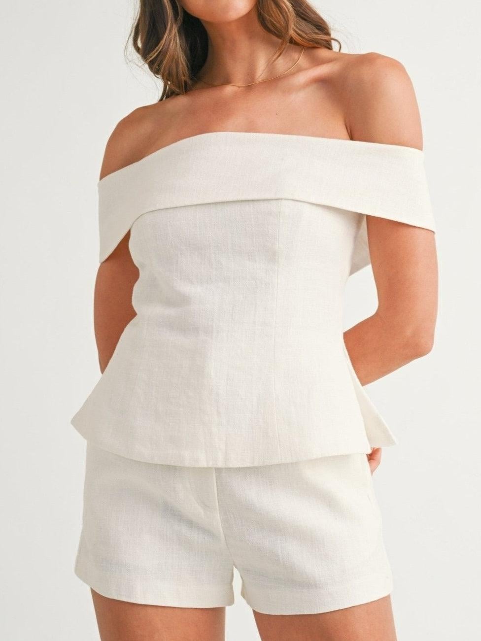 White elegant two-piece tailored suit with flattering silhouette, front view