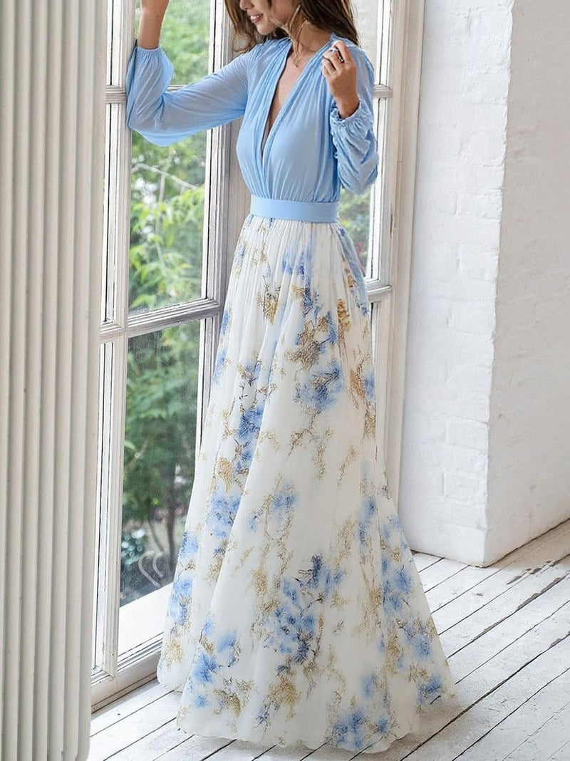 Close-up of the floral print fabric detail on a lightweight breathable maxi dress in a colorful pattern