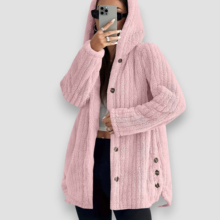 Woman wearing a soft plush hooded cardigan in a relaxed fit, styled for a cozy winter look