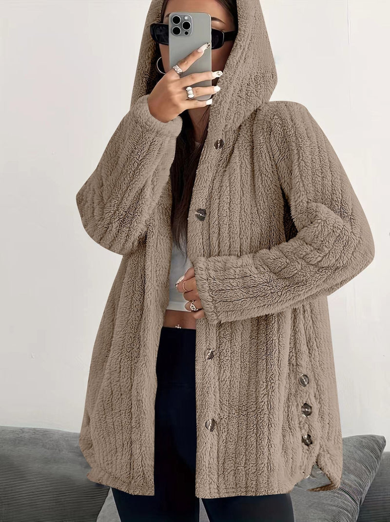 Woman layering the Kendall hooded cardigan over a casual outfit with jeans