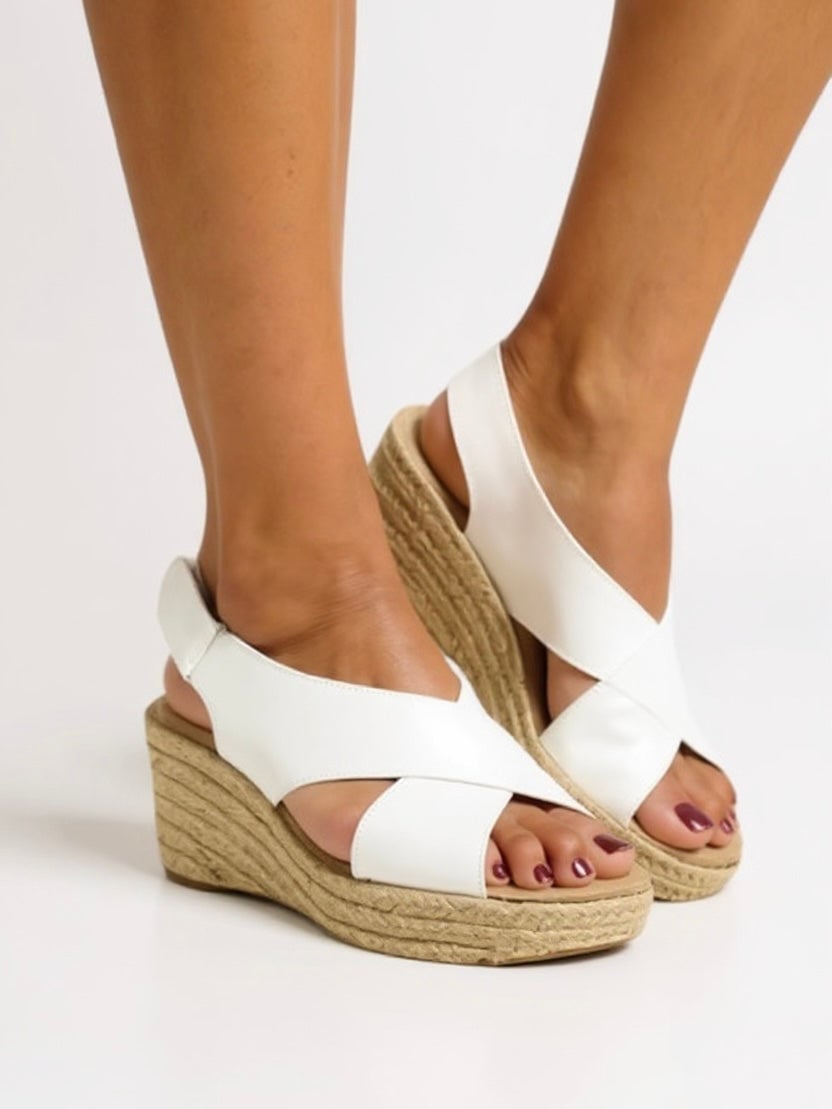 Kendall woven wedge sandal in beige with ankle strap, side view on neutral background