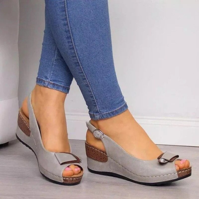 Kenzie women's cushioned sandal in gray displayed at an angle highlighting the ergonomic footbed