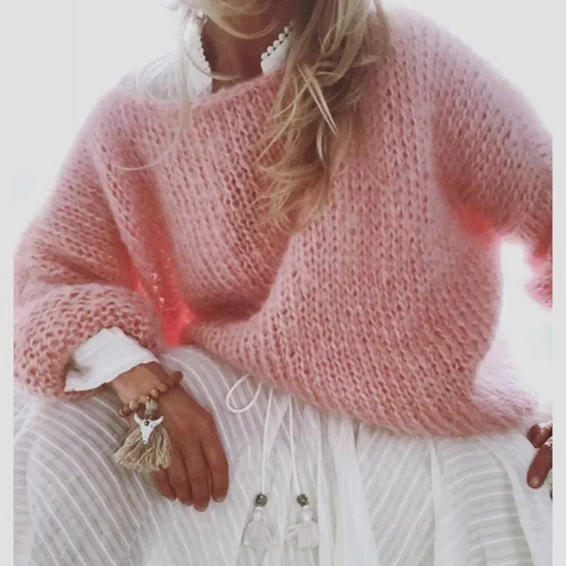 Woman styling the Kerry knitted sweater with jeans and a scarf for a weekend casual look