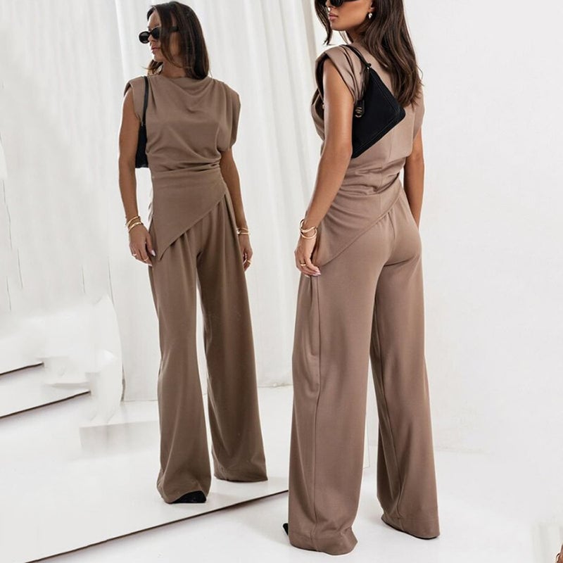 Three-quarter view of the Khloe set in light gray emphasizing the waist-cinching draped top
