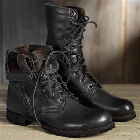 Close-up of lace-up detail on women's dark brown boots highlighting the leg-lengthening silhouette