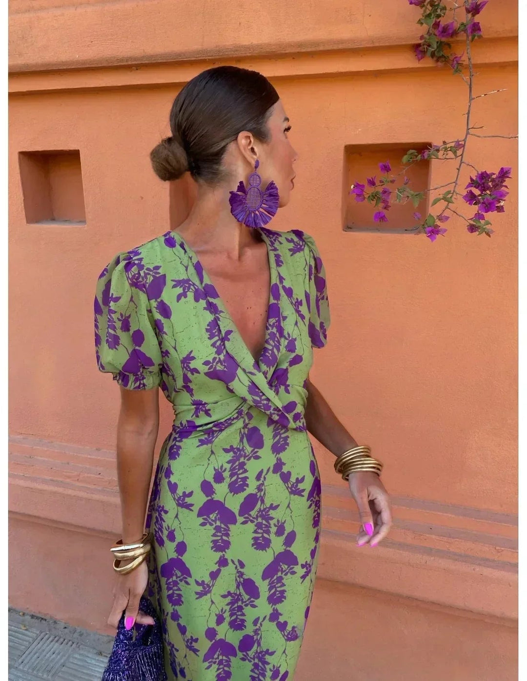 Woman styling the green Florimay summer dress with sandals for a casual daytime look