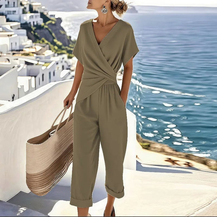 Full-length view of the two-piece wrap top and cropped trouser set styled for a casual outing
