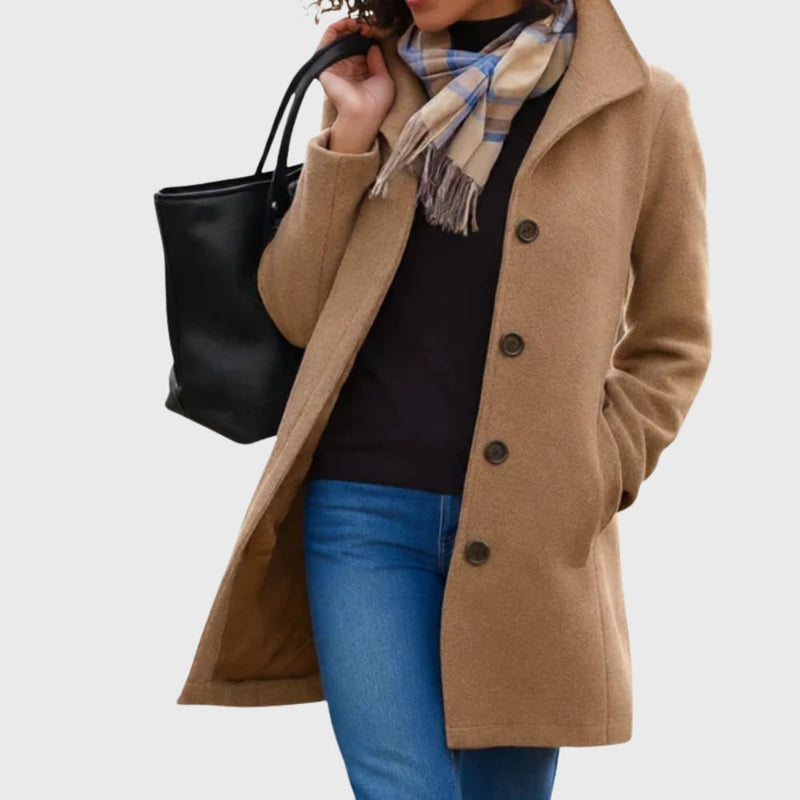 Woman wearing the Kimmy flattering longline coat in khaki, showcasing the sleek elongated silhouette