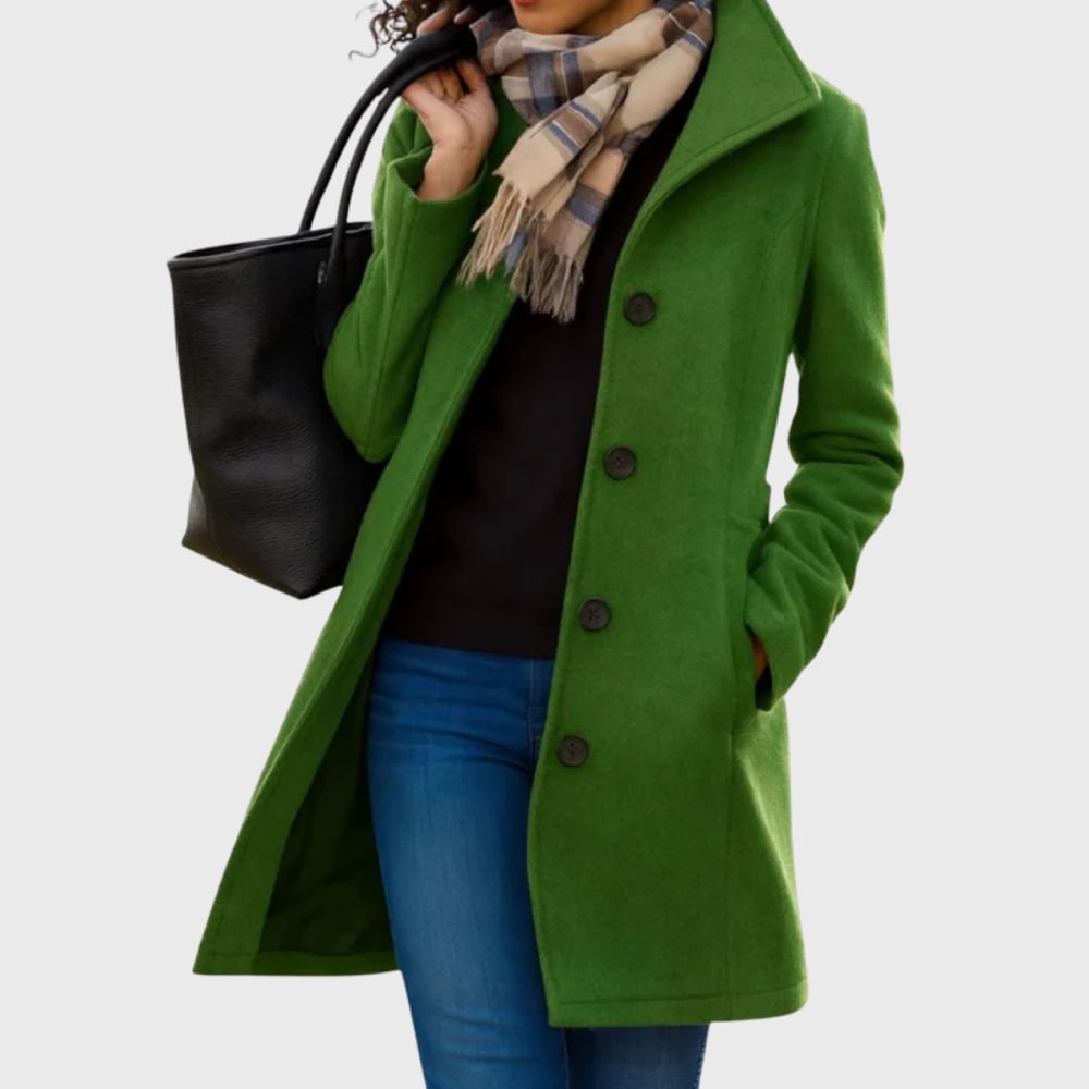 Close-up of the Kimmy longline coat fabric and pocket detail in moss green