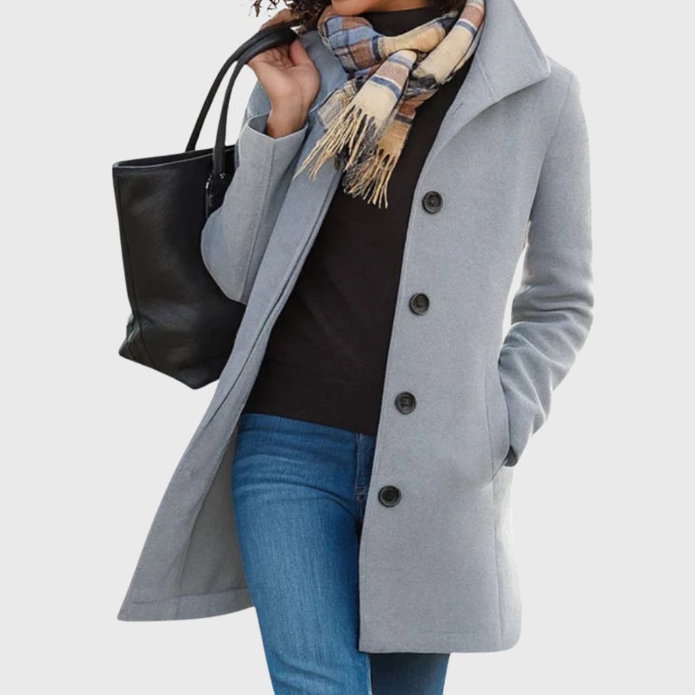 Woman styled in the Kimmy longline coat in light grey over a casual outfit for a polished everyday look