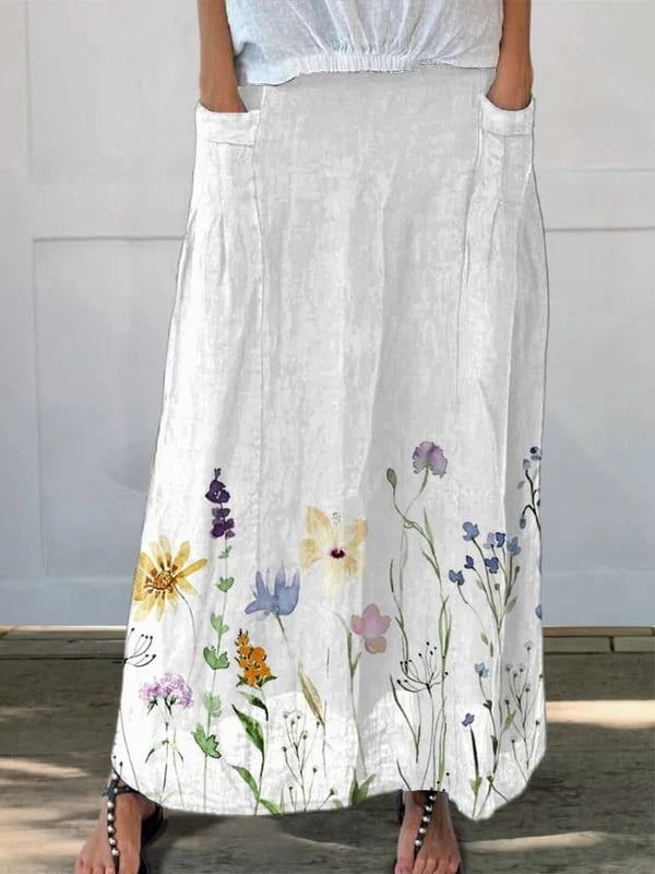 White watercolor spring meadows printed A-line skirt with elastic waistband and side pockets, shown in full length