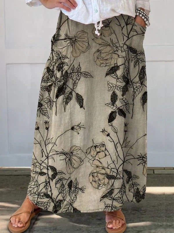 Khaki retro floral print A-line linen skirt with elastic waistband and side pockets, shown flat