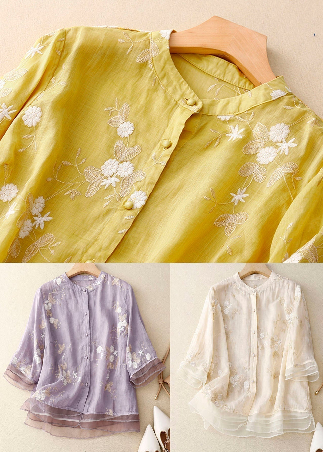 Detail shot of the button patchwork and floral embroidery on a summer blouse