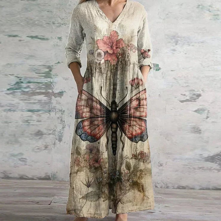 Full-length view of a woman in a navy blue elegant retro maxi dress styled for a garden party