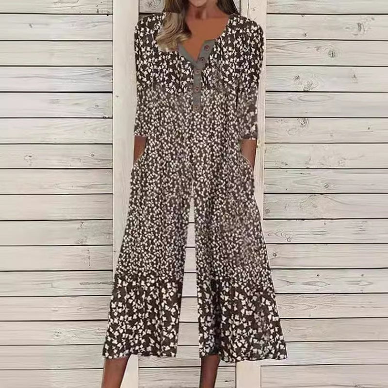 Close-up of the all-over watercolor leaf and branch print on the light blue Lagoon jumpsuit