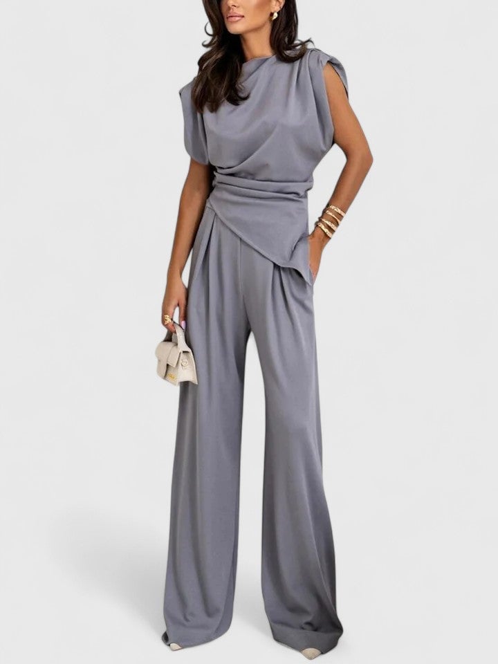 Side view of the Laiza two-piece set in peach highlighting the flowing wide-leg silhouette