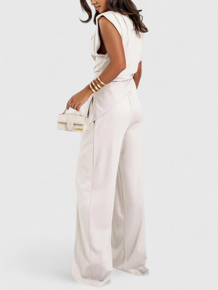 Woman wearing the Laiza draped set in brown with padded shoulder detail