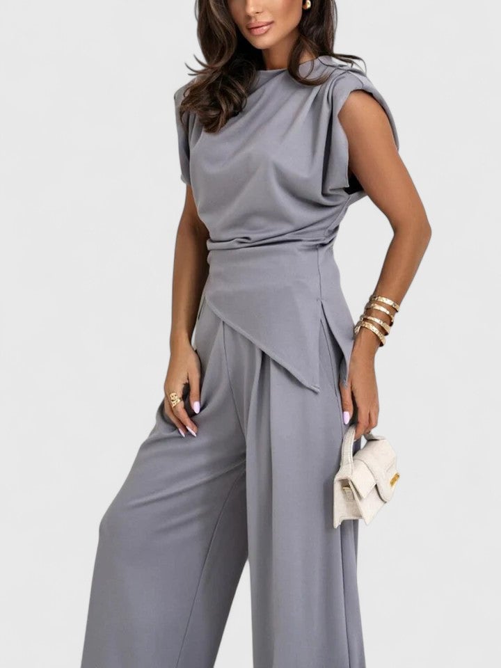 Full-length front view of the Laiza set in dark grey with asymmetric top and palazzo pants