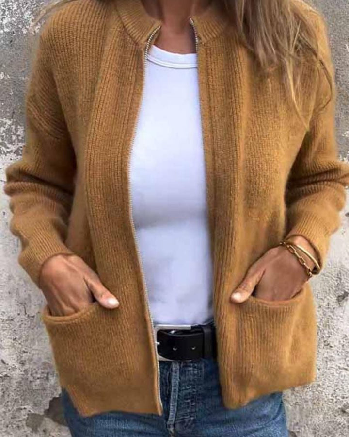 Woman styled in a black Lana cardigan layered over a casual outfit