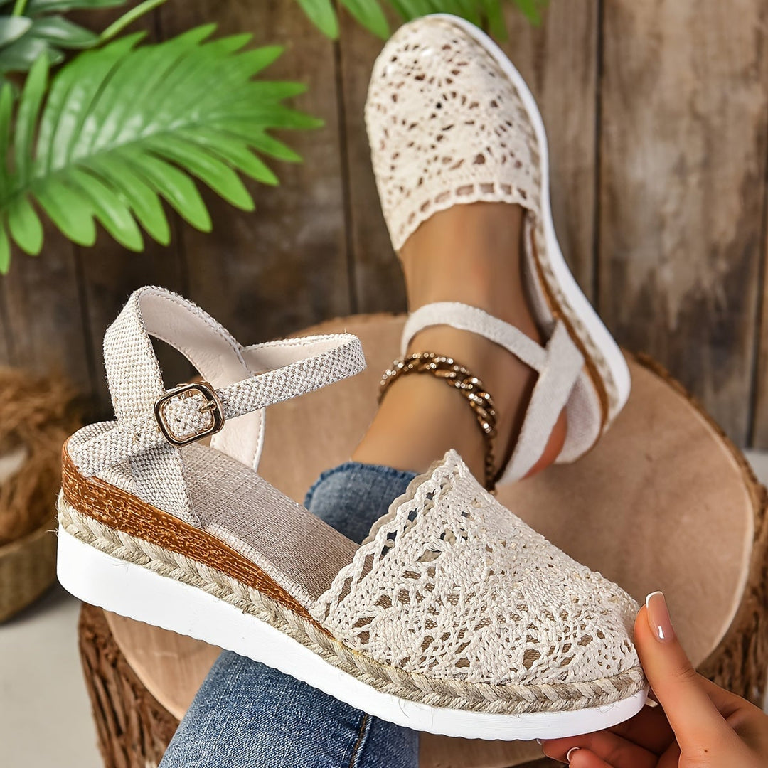 Close-up of Lantana sandal adjustable strap buckle detail in beige