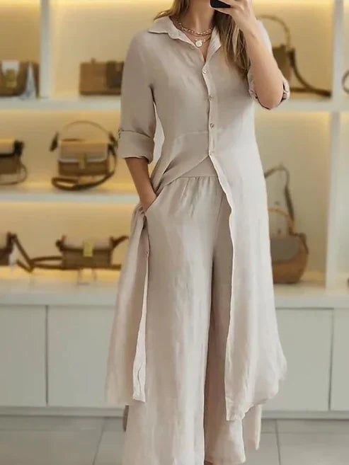 Side view of the Lara shirt maxi dress highlighting the relaxed silhouette and 3/4 rolled sleeves