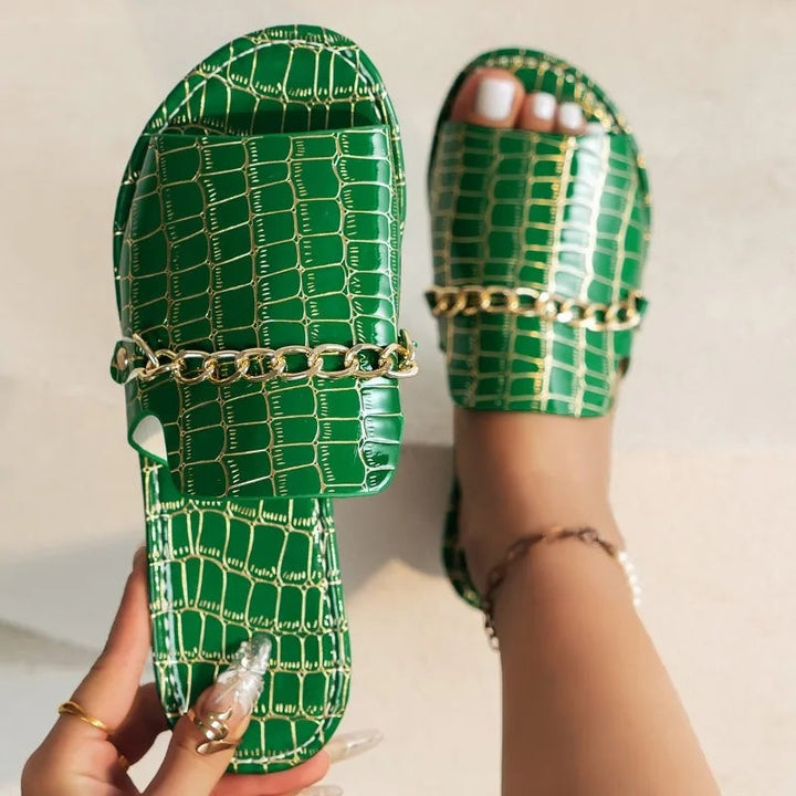 Lark sandals in red croc-embossed finish on a clean white background