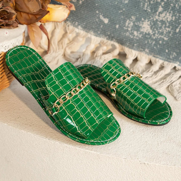 Close-up of Lark sandal strap detail highlighting croc texture and secure fit