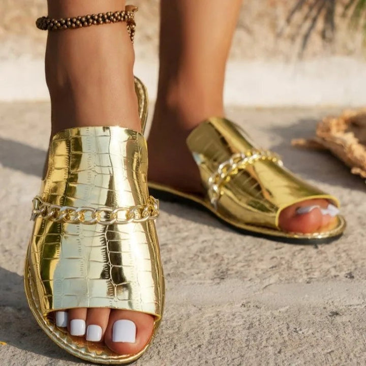 Lark women's sandals in gold croc-embossed finish, front three-quarter view