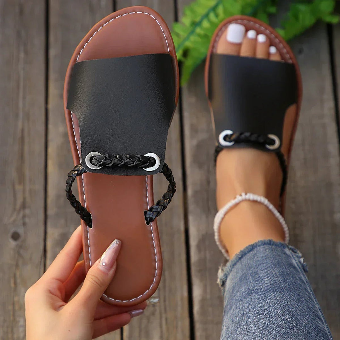 Larkspur boho woven sandals in Onyx Shade shown from the side to highlight flexible sole