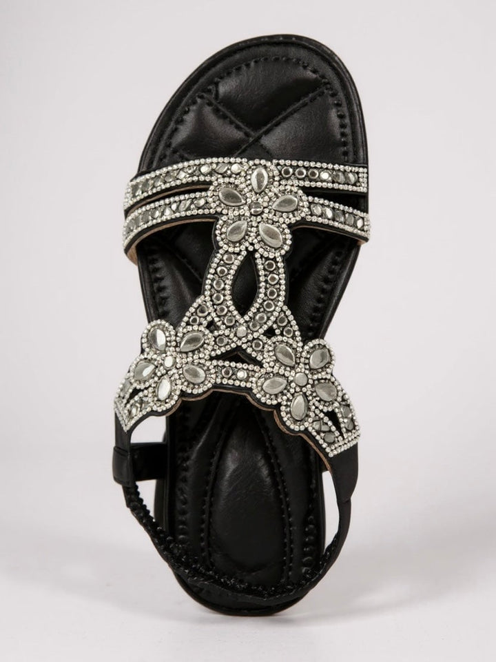 Top-down view of Larkspur sparkle sandals in black highlighting the sparkle strap detail