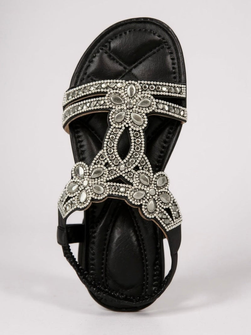 Top-down view of Larkspur sparkle sandals in black highlighting the sparkle strap detail