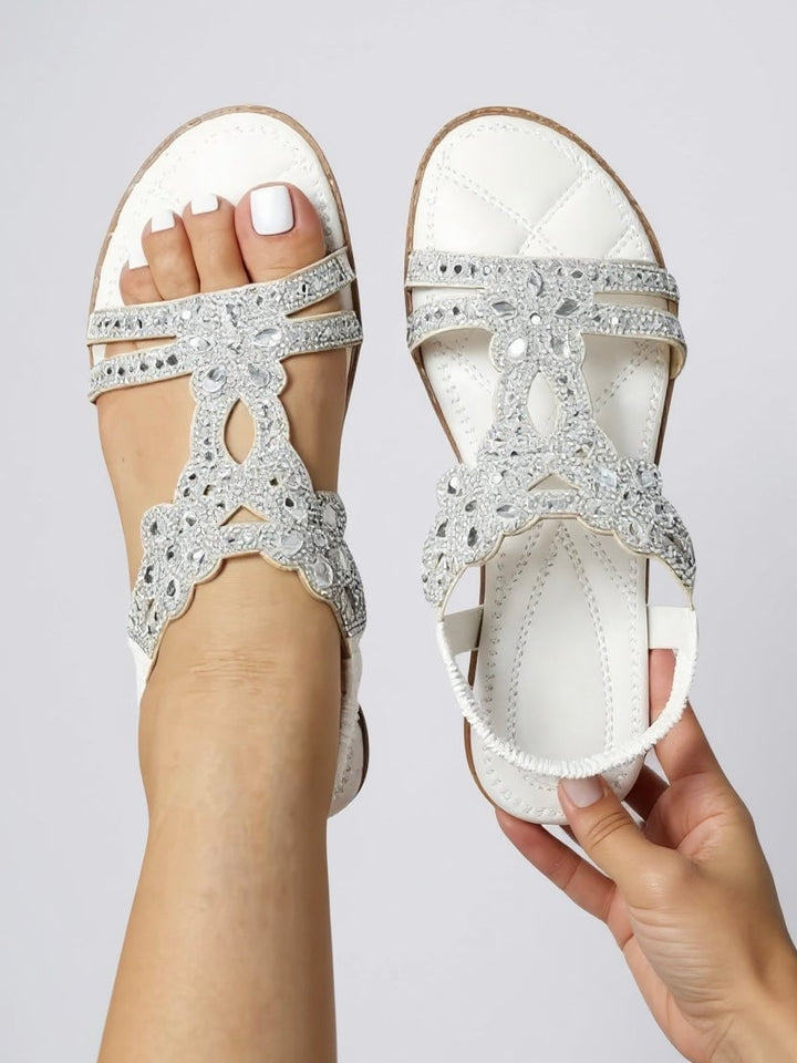Larkspur sparkle sandals in white styled on a light surface showing full silhouette