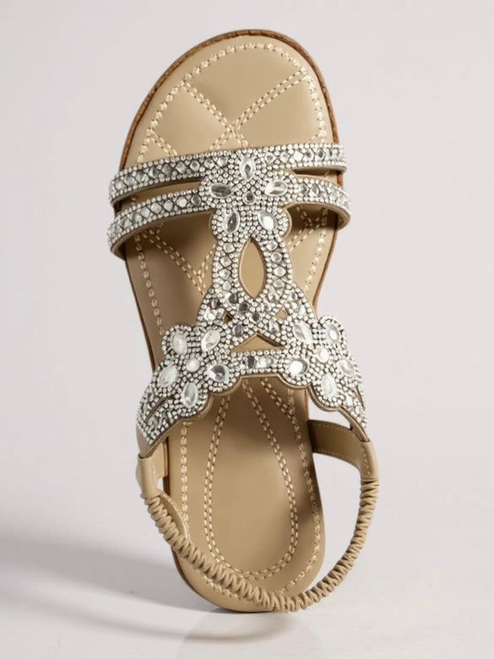 Close-up of Larkspur sparkle sandal strap embellishments in beige colorway