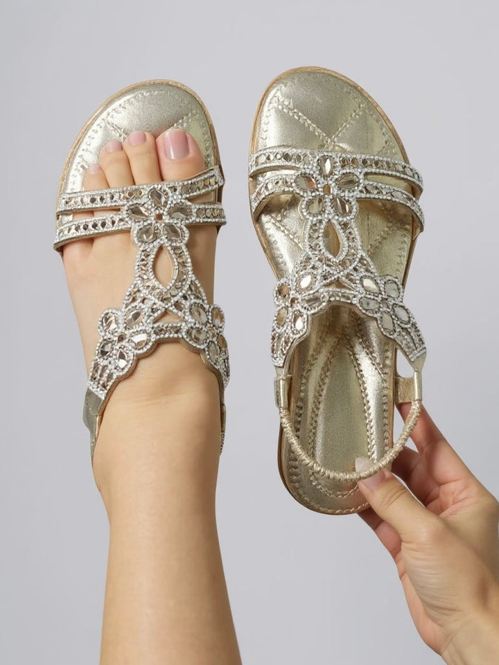 Pair of Larkspur sparkle sandals in light blue displayed on a neutral background