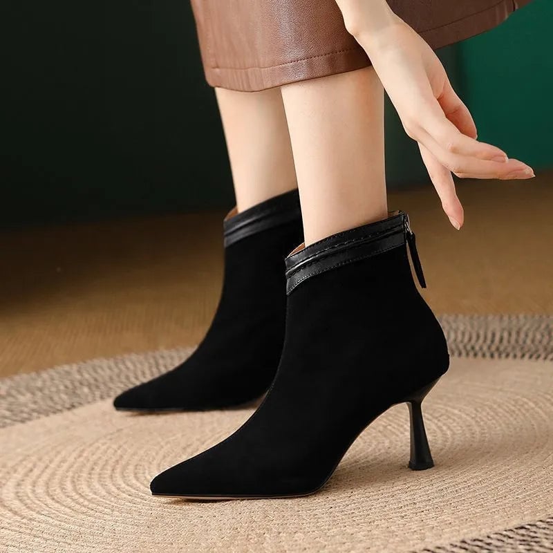 Florimay Laura ankle boots in black with a smooth contoured silhouette, side view