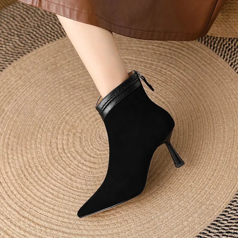 Laura ankle boots in brown styled with slim-fit jeans on a model