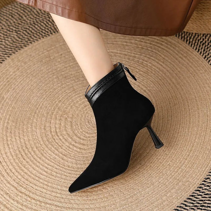 Laura ankle boots in brown styled with slim-fit jeans on a model