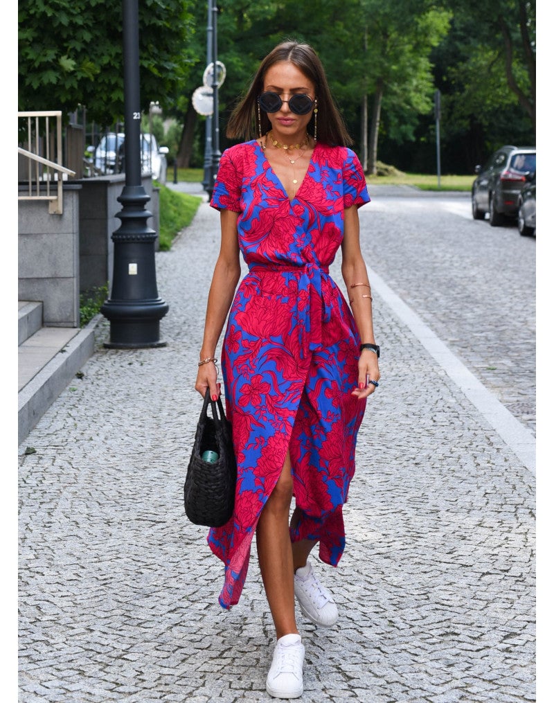 Side profile of model in the Lauri floral dress showing the flattering feminine fit and flowing skirt