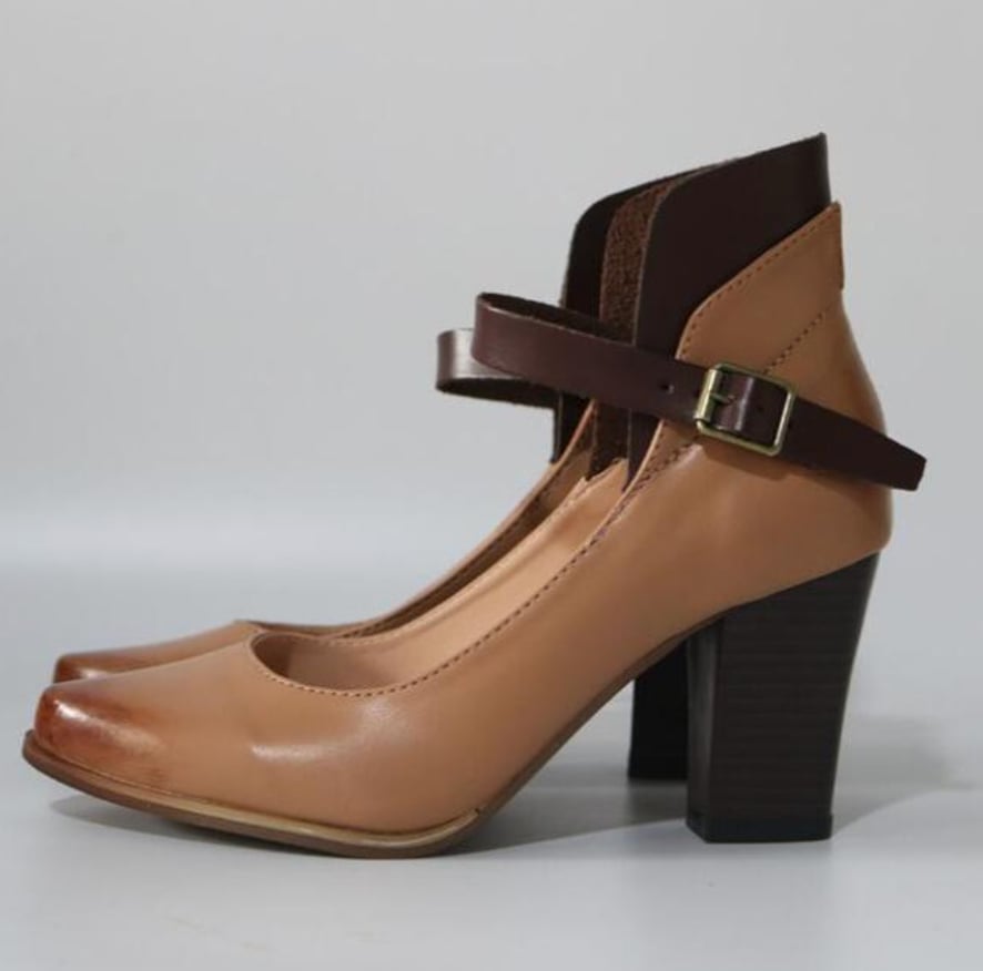 Women wearing elegant heel sandals with adjustable straps styled with a flowing dress