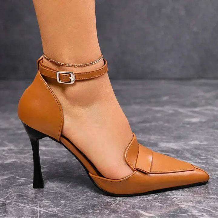 Lavinia pointed toe heels in black with ankle strap buckle, side view