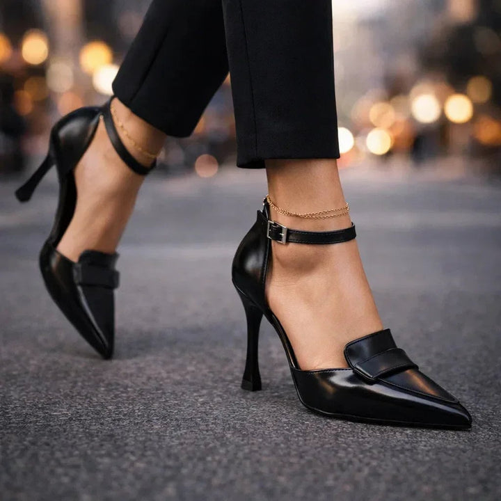 Close-up of Lavinia ankle strap buckle detail on brown heels