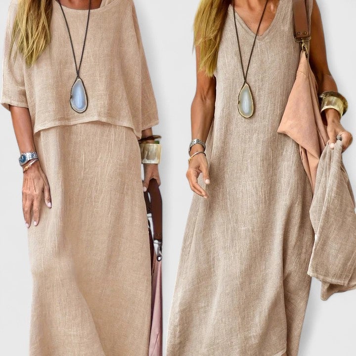 Woman wearing the Lea linen two-piece set with short-sleeve top layered over a khaki V-neck maxi dress