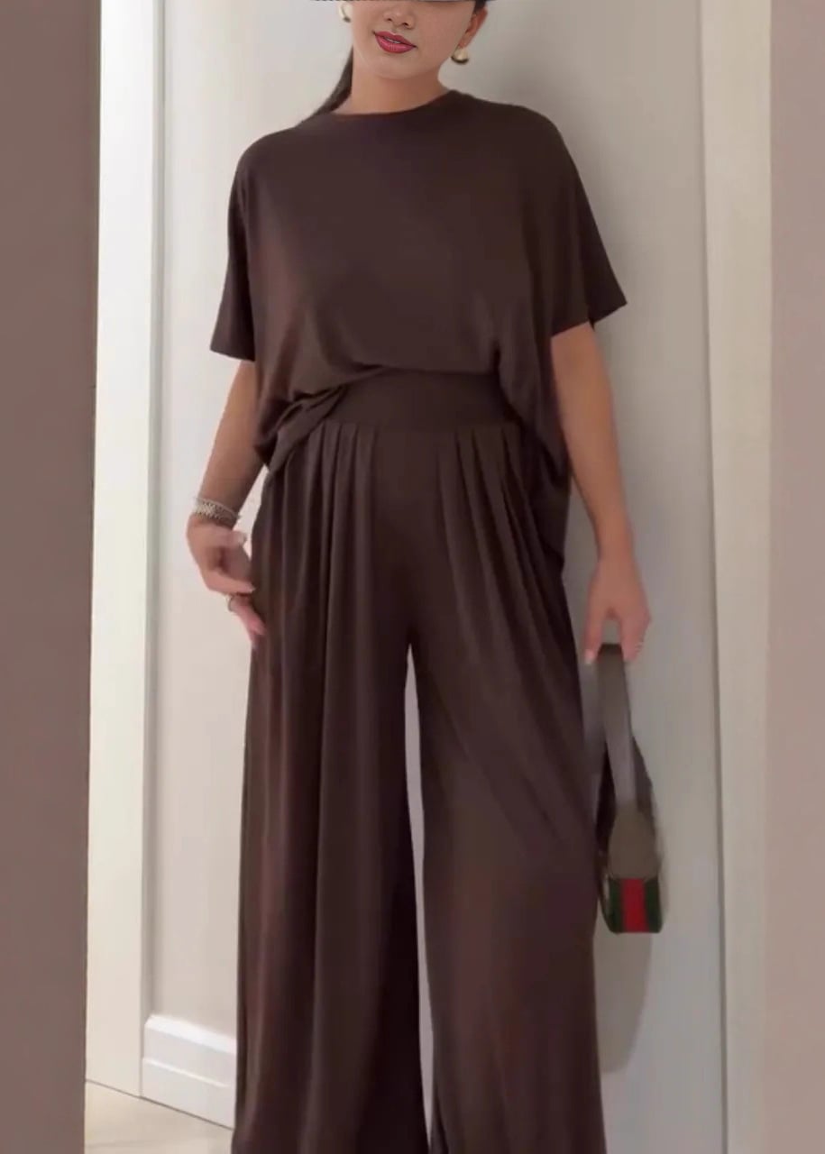 Model wearing a brown casual top and wide-leg pants two-piece set with a relaxed, flowing silhouette